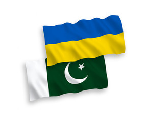 National vector fabric wave flags of Pakistan and Ukraine isolated on white background. 1 to 2 proportion.