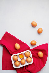 Eggs, towel in rustic style on light background. Organic ingredient, healthy food lifestyle concept. Easter background