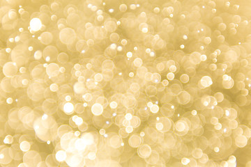 abstract gold background with soft blur bokeh light effect, background bokeh