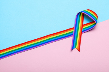 LGBT pride rainbow ribbons on blue and pink background