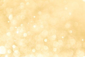 abstract gold background with soft blur bokeh light effect, background bokeh