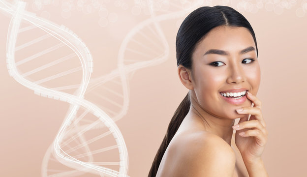 Portrait of asian woman next to white DNA chains