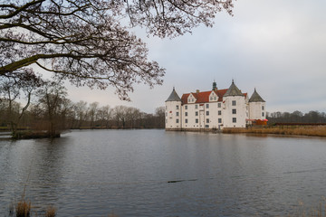 Fototapeta premium Glücksburg Castle from the side by the water and bad weather