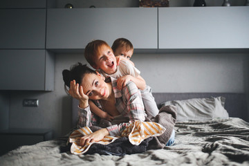 tired mother with two children,Authentic lifestyle - obrazy, fototapety, plakaty