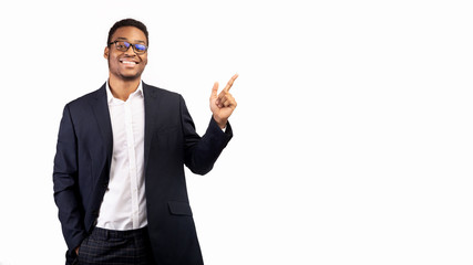 African guy pointing at free space with index finger - Powered by Adobe