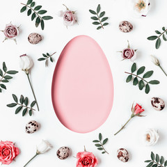 Pink Egg shaped hole with copy space. Creative layout with floral pattern and quail eggs. Happy easter concept