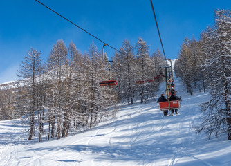 Bardonecchia, Italian Alps, snowy scenery: ski slopes and chairlift (chair lift), ski resort and winter snow landscape. Photos with Snow