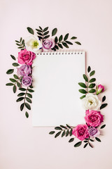 Empty Notepad and floral frame in pastel colors. Romantic concept, boho style