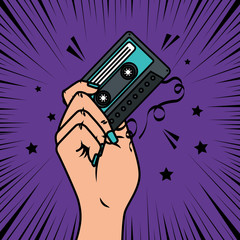 hand with cassette music pop art style icon vector illustration design