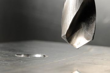 Metal drill close-up, blurred background
