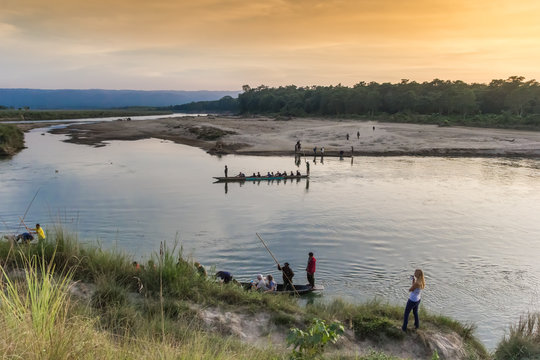 Canoes in the river at sunset in Sauraha, Nepal
