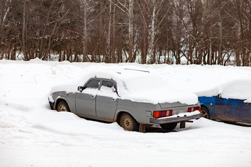 Car under the snow. Russia.