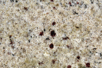 White marble rock texture with dark red minerals