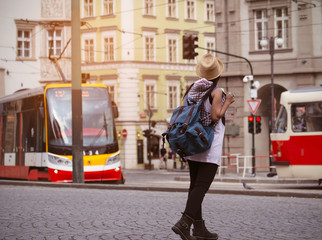Female Tourist waiting the tram,using public transportation in foreign country.Tourist in Prague...