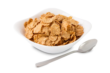 Corn flakes in white plate on a white background isolated