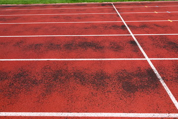 Outdoor athletics stadium constructed from synthetic rubber
