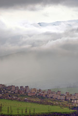 Naklejka na ściany i meble Alaverdi town on the background of the mountain and clouds. Lori Region, Armenia.