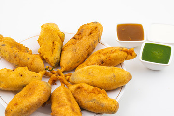 Indian Street Fried Food Spicy Chilli Pakora Served With Sauce & Chutney Also Know as Mirchi Bajji,...