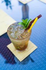 Summer mojito cocktail on the pool table