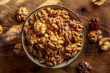 tasty healthy peeled walnuts on a wooden board