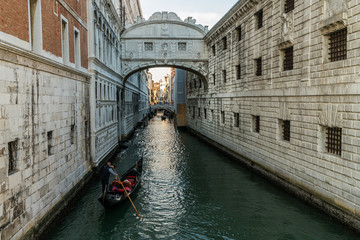 Fototapeta na wymiar The Bridge of Sighs, famous bridge connects the Doge’s Palace to the prison, in Venice, Italy with gondolas