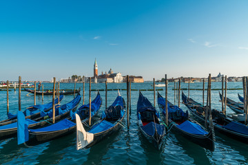 Venice gondolas with the view of San Giorgio Maggiore church from San Marco square in Venice, Italy.