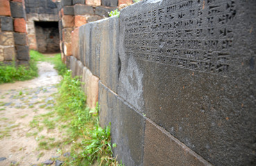 Cuniform inscription on the wall of Erebuni Fortress (Urartu time). Yerevan, Armenia.