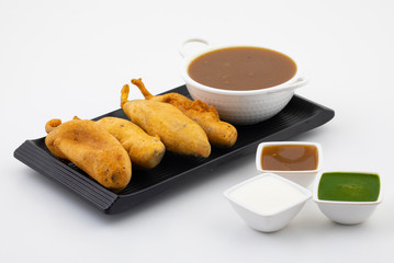 Indian Street Fried Food Spicy Chilli Pakora Served With Sauce & Chutney Also Know as Mirchi Bajji, Mirchi Vada, Mirchi Bada, Chili Cutlet or Chili Bajji It's a Popular Tea Time Snacks From India