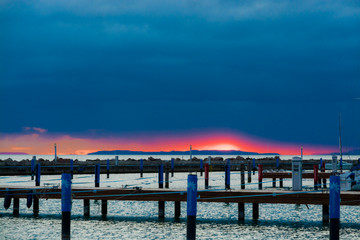 Fototapeta na wymiar Orange sky under clouds in the winter sunset in Balaton