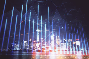 Financial graph on night city scape with tall buildings background multi exposure. Analysis concept.