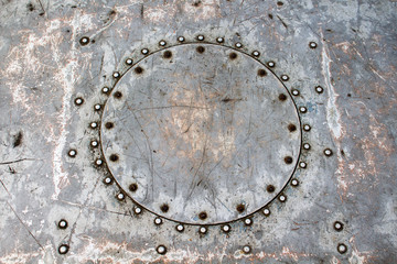 Patch round shape of the welded metal rivets on old metal surface barges