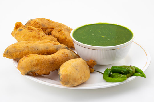 Indian Street Fried Food Spicy Chilli Pakora Served With Sauce & Chutney Also Know as Mirchi Bajji, Mirchi Vada, Mirchi Bada, Chili Cutlet or Chili Bajji It's a Popular Tea Time Snacks From India