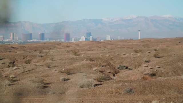 The desert landscape comes into focus before the Las Vegas Strip.