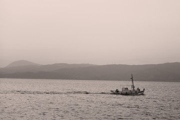 boat on the sea at sunset