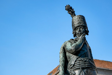 statue of a thinking man looking doubtfully 