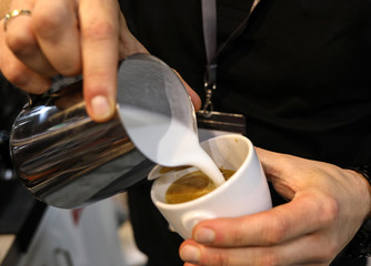 Barista making coffee at coffee machine
