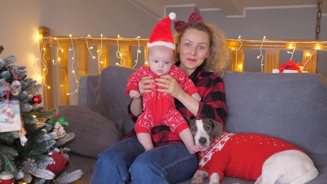 Happy Christmas Concept. Mother Kissing Her Baby Son.