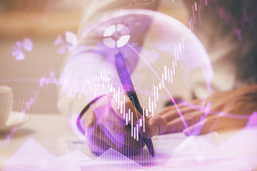 Financial trading chart multi exposure with man desktop background.