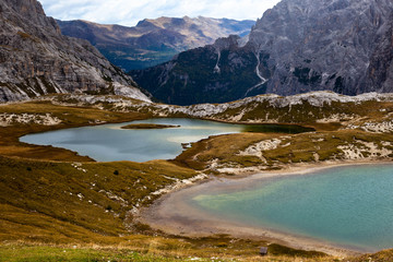 Colorful turquoise lakes in the The Cime di Lavaredo National Park, also known as Drei Zinnen or Three Peaks of Lavaredo. The lakes are surrounded by the mountains. South Tyrol, Italy. 