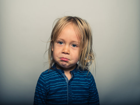 Portrait of toddler pulling faces