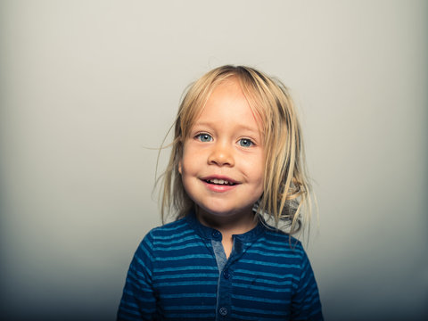 Portrait of toddler doing smiling faces
