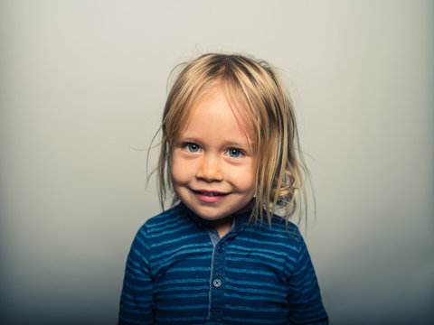 Portrait of toddler doing smiling faces