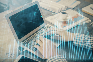 Double exposure of forex graph with man working on computer on background. Concept of market analysis.