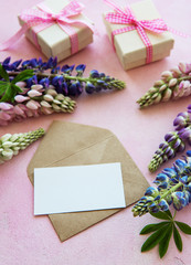 Obraz na płótnie Canvas Mockup greeting card with lupine flowers