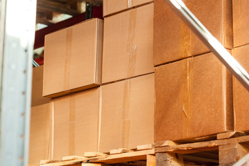Modern warehouse shelves with pile of cardboard boxes