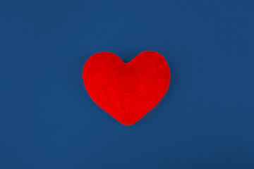 Red heart on color background. minimal concept.