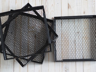 Black grid from a home dryer of fruits and vegetables.