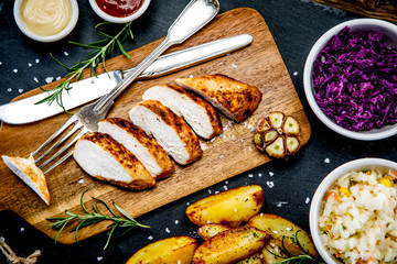  Barbecue chicken fillet with baked potatoes and vegetables