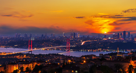 Bright sunset and the Boshporus Bridge in Istanbul, view from the Asian side, Turkey