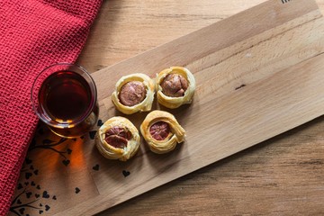 .tea, bagel, hot dog puff pastry concept